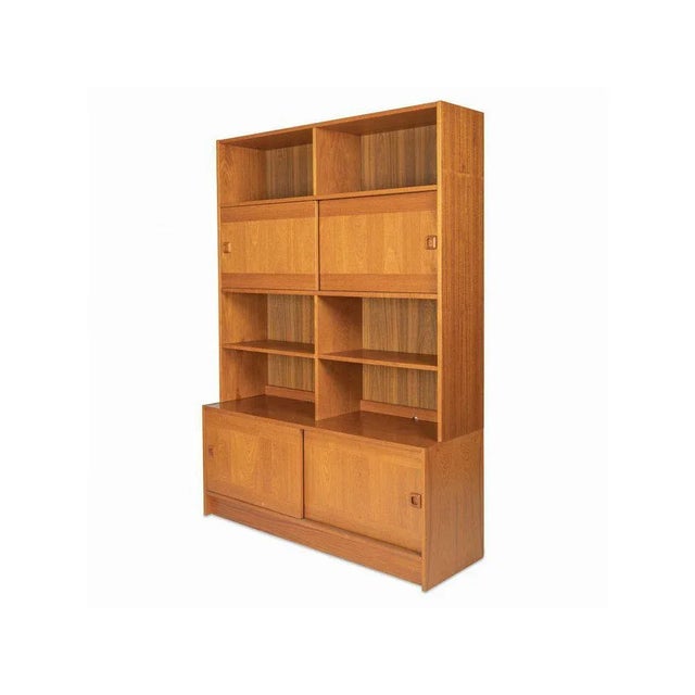Wooden shelving system from the 1960s by the Danish company Domino Møbler, one of the most important manufacturers of...