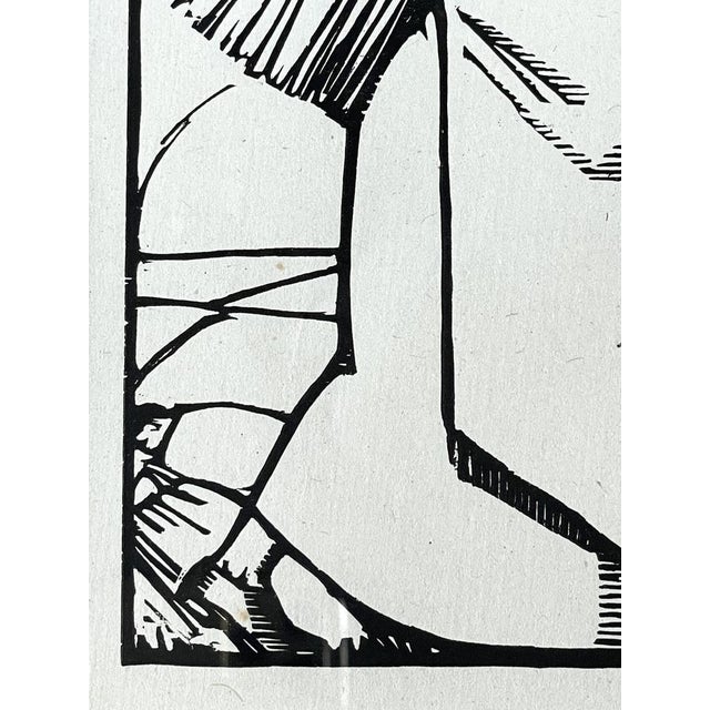 Art Deco woodcut of a reaper carrying a bundle of grain. Graphics from the "Harvest" series dealing with the subject of...