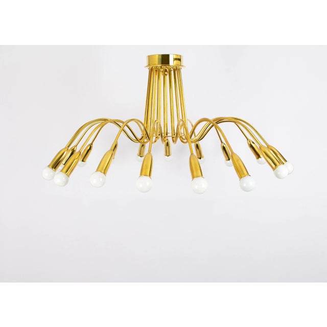 A stunning extra large eighteen-arm spider flush mount light chandelier, manufactured in germany, circa 1970 (late 1960s...