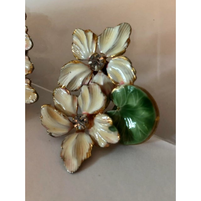 This is part of Chairish’s Costume Jewelry assortment. The pictures of these Vintage Floral Enamel and Rhinestone Clip on...