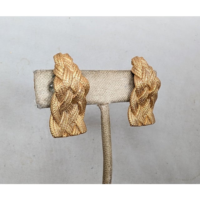 1960s goldtone "woven" clip and adjustable screw back earrings. Marked "NAPIER©" on the clips. Measure: 1 1/4 inches long...