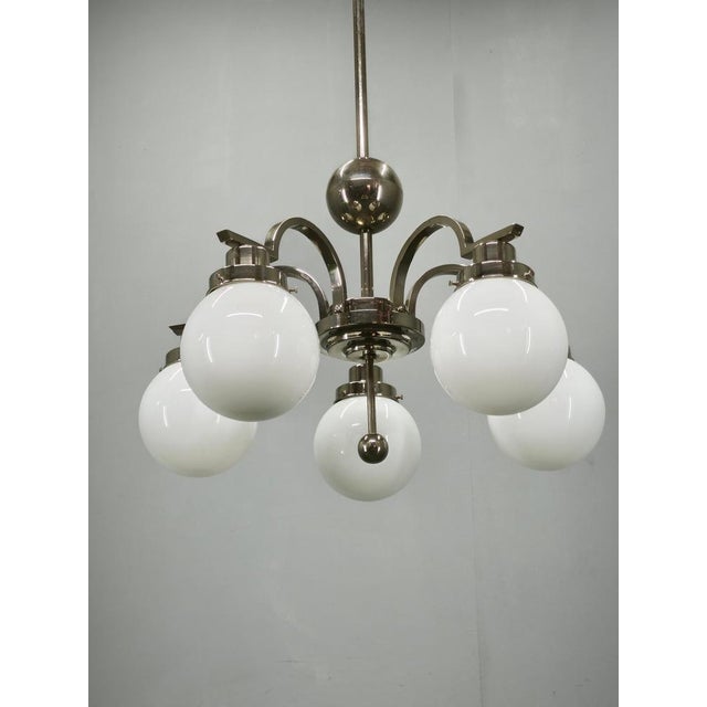 Exceptional original Art Deco chandelier produced in Czechoslovakia during the 1930s. Crafted from chrome-plated metal and...