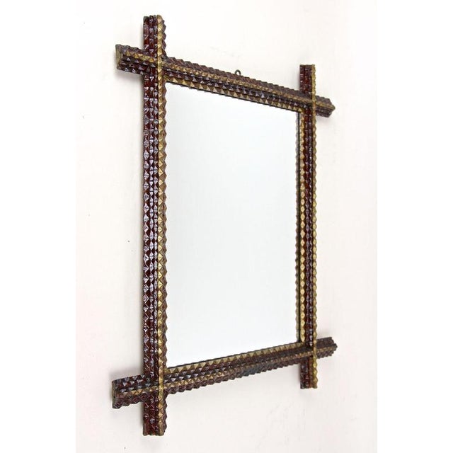 Unique handcarved Tramp Art Wall Mirror from the late 19th century in Austria. Artfully crafted around 1880, this...