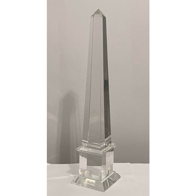 Large vintage French crystal obelisk with stepped base and elegant tall spire. Measures 17 3/4" tall x 3 7/8" square at...
