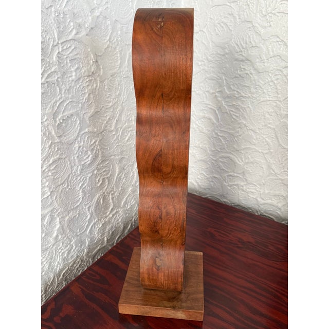 This is a vintage wavy bentwood wine holder for four bottles. Wood has a warm medium brown tone with visible grain. Please...