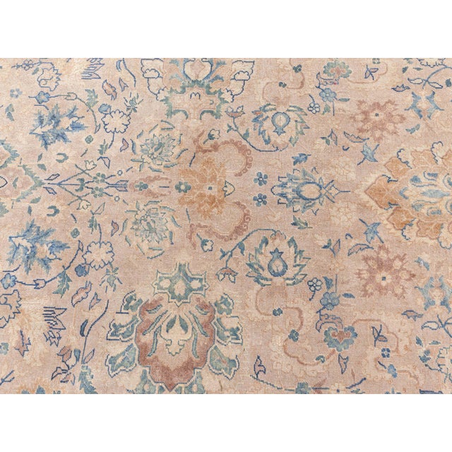 Emanating an air of serenity and refined elegance, this antique North Indian rug from the early 20th century captures the...