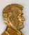 We are selling this well gilt brass plaque of Abraham Lincoln. This piece is finely cast and probably was mounted to a...