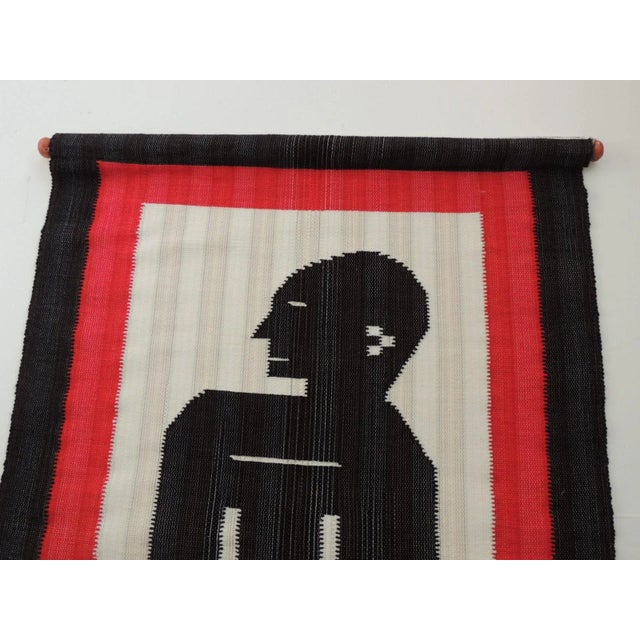 Woven Red and Black Wall-Hanging Depicting Seating Man For Sale - Image 4 of 6
