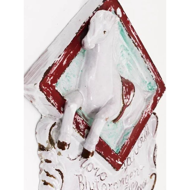 A decorative advertising sign, made of ceramic, dated around 1920s, made in Italy. An advertising sign for selling Italian...