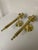 An exquisite pair of Neoclassical Style Brass Candle Sconces in the style of Maison Jansen. Circa 1980s. These high gloss...