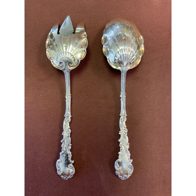 A sterling silver serving set in the very collectible pattern of Versailles by Gorham. They each measures approximately...