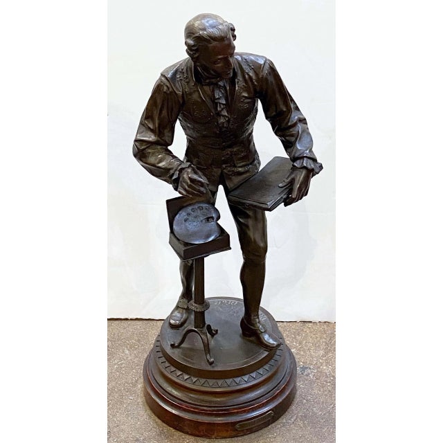 A large French sculptural figure of an artist or painter from the Louis XV period, mounted to a circular moulded base of...