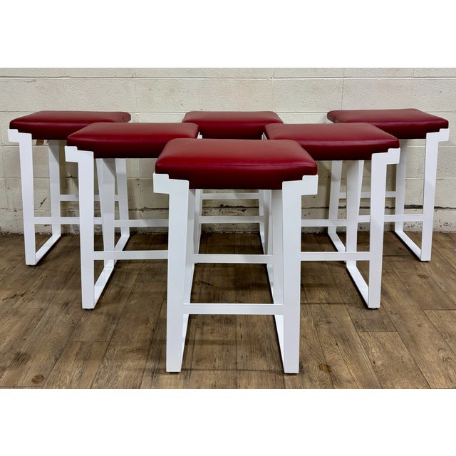 This is an absolutely stunning and rare, likely custom made, set of 6 white metal and burgundy top barstools by Cabot...