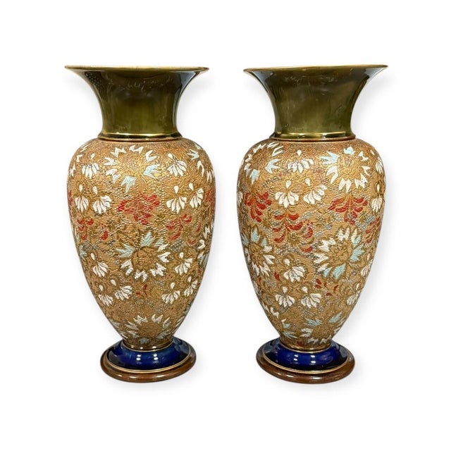 Impressive matched pair of Slater’s Patent stoneware vases by Royal Doulton, richly decorated with an all-over floral...