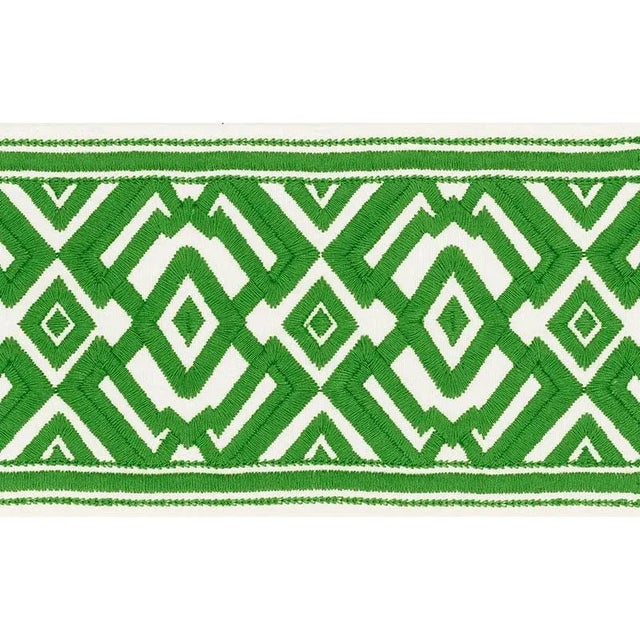 A statement-making, extra-wide tape with a distinctive embroidered diamond pattern inspired by a document in our archives....