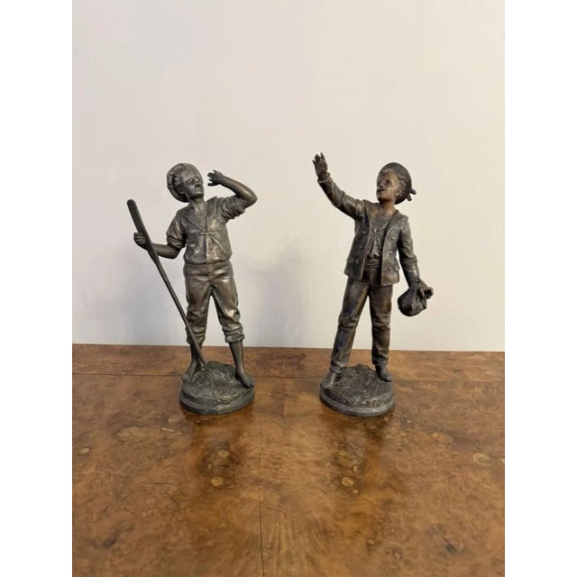Quality pair of antique French spelter figures, having a quality pair of antique French Spelter figures, raised on...