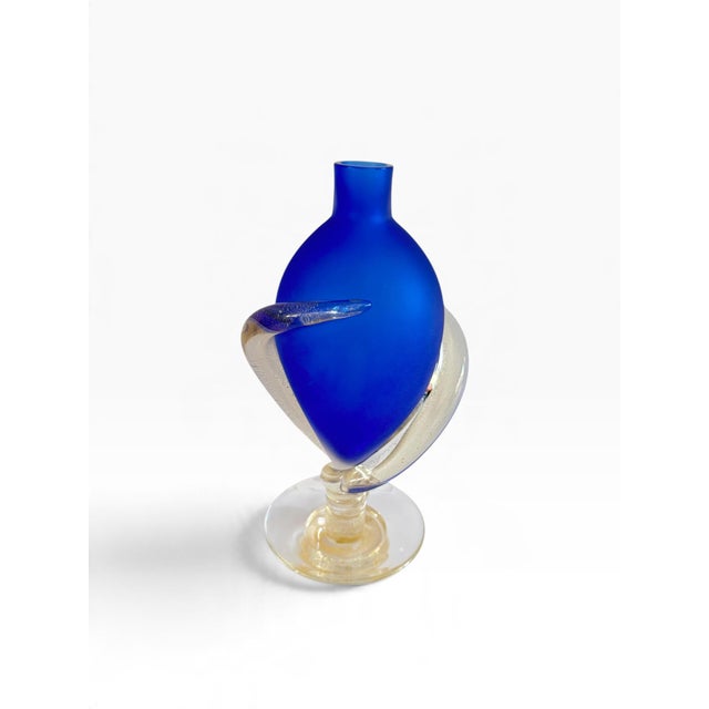 Striking hand-blown cobalt blue glass vase wrapped in a crystal with gold embellishment and base. Designed by Marino Santi...