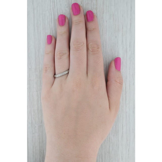 Metal: 18k White Gold Weight: 4.3 Grams Stamps: 18k Rise Above Finger: 1.8 mm Band / Shank Width: 3.4 mm This ring is a...