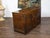An English Georgian period elm buffet from the 18th century with two doors, recessed panels, iron and brass hardware and...