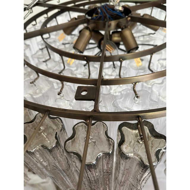 Scenographic and luxury flush mount , all made in italy, made in murano glass. transparent and fumè color give warm and...
