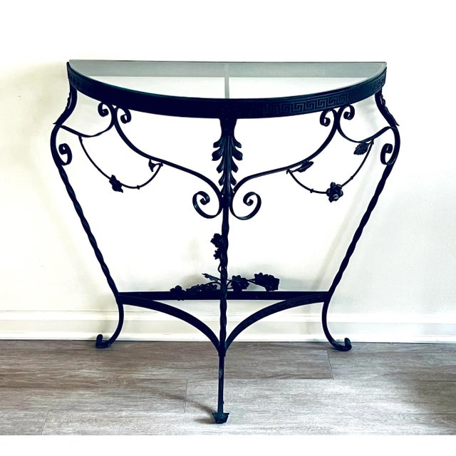 Stunning antique C1920s Italian wrought iron demilune console table with glass top and scrolled feet. Elaborate detailing,...