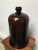 A beautifully preserved antique amber glass apothecary dome, distinguished by its rich coloration, elegant proportions,...