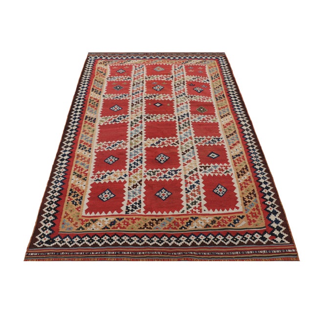 Handwoven in wool, originating from Turkey circa 1950-1960, this 4x7 vintage kilim features a design that looks most...