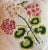 Vintage botanical needlepoint flower pillow showing pink geraniums and green leaves. Executed with a combination of small...