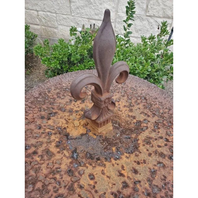 A one-of-a-kind antique architectural ironwork, handmade from salvaged building elements, having a rustic, heavily...