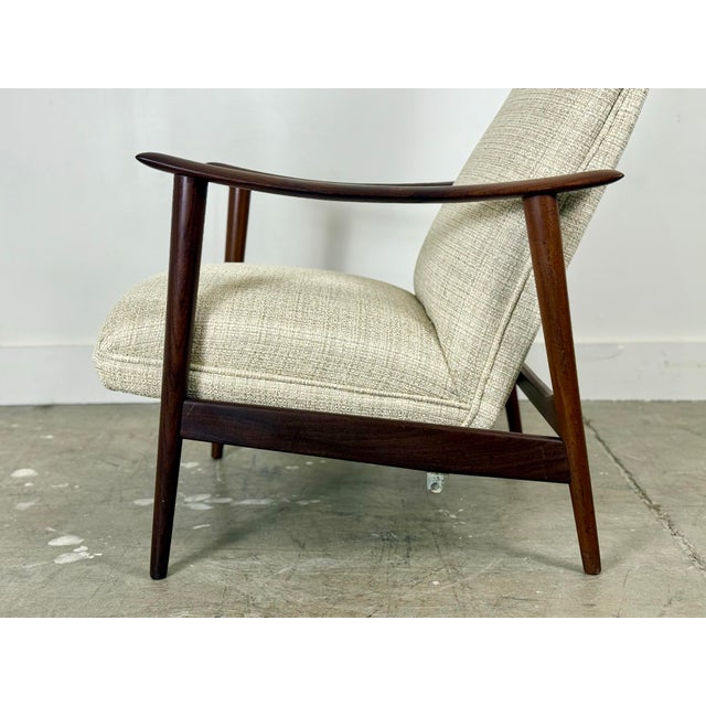Vintage solid old growth teak rocker recliner by Arnt Land for Stokke, Norway circa 1960. Known as the "Combi Star" chair...