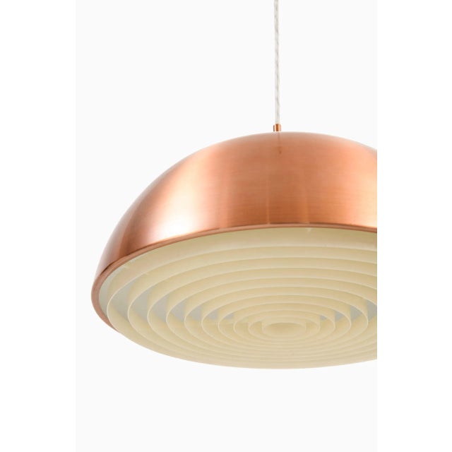 A pair of ceiling lamps by unknown designer. Produced in sweden. Dimensions (w x d x h): 45 x 45 x 24 ( 120 ) cm. Wear...