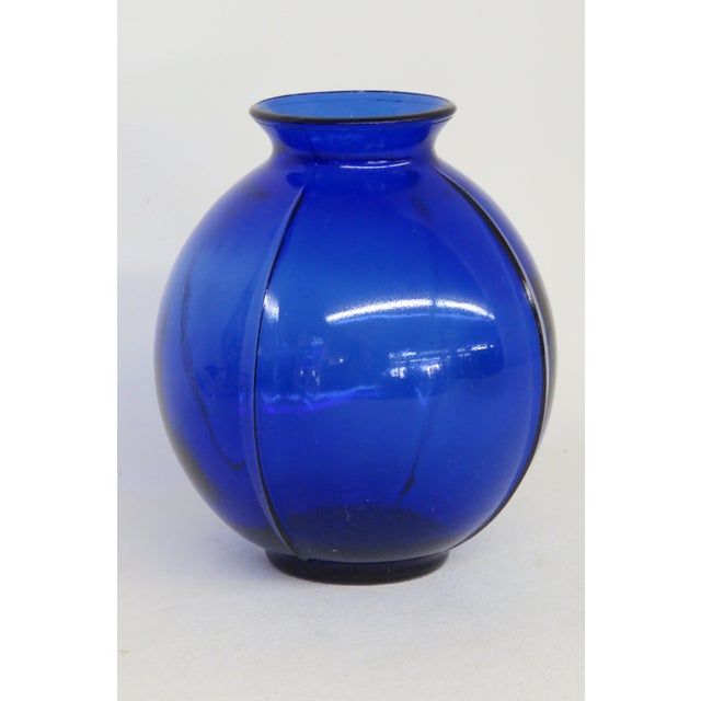 This beautiful Vase is made out of glass. This Vase features a gorgeous cobalt blue color and a wonderful ribbed design to...