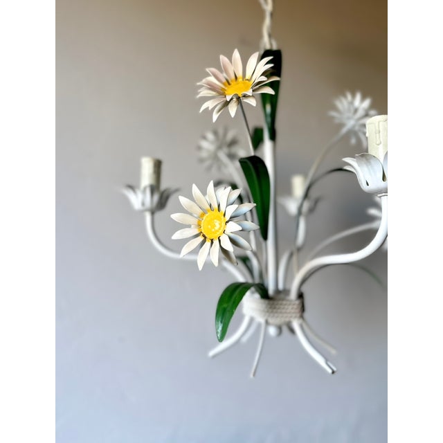 Italian three-light tole chandelier dating from the 1970s. Hand-formed white daisy flowers, green leaves, and tulip-form...