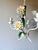 Italian three-light tole chandelier dating from the 1970s. Hand-formed white daisy flowers, green leaves, and tulip-form...