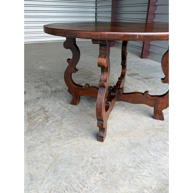 This is a lovely and versatile sized 47" dining table from 19th Century Spain. Its walnut wood grained baroque style legs...