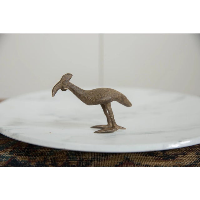 :: Vintage handmade African bronze Kori bustard bird. Circa mid 20th century and possibly older, this piece has such...