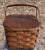 This is a very fun picnic basket ready to be used for a lovely outing, storage, or decoration. The handles are made out of...