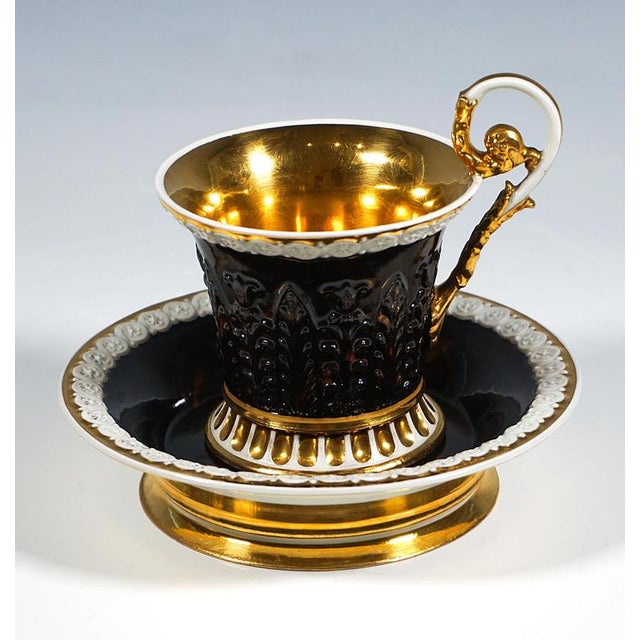 Finely decorated porcelain cup with saucer: Porcelain cup with a curved, flared wall and a footring flaring outwards at...