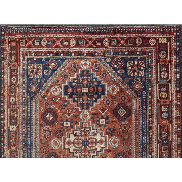 Persian Shiraz antique rug in blue and brunt orange with Medallion geometric design, Keivan Woven Arts / rug...