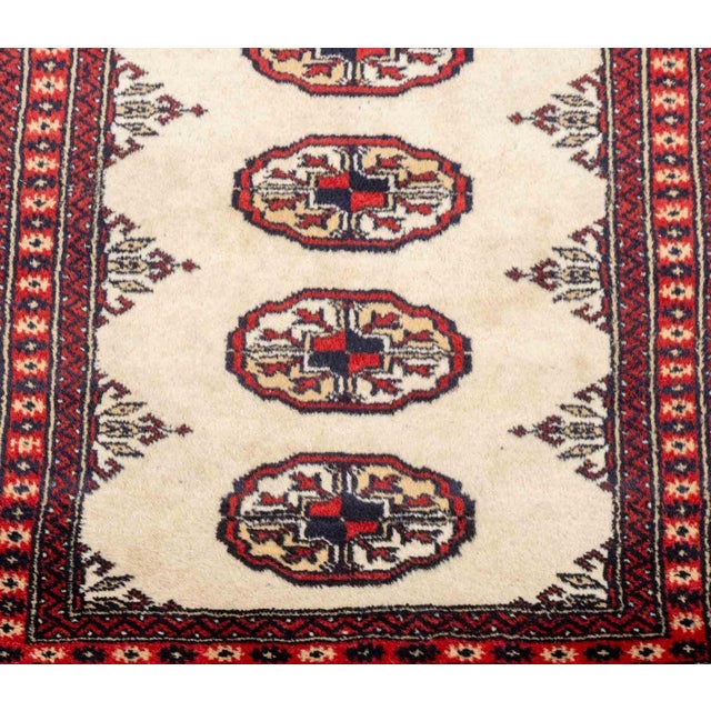 Persian Turkmen Bokhara Wool Prayer Rug, with gul motif in red and beige with fringe on the short sides. 3' 5" L x 2' 1"...