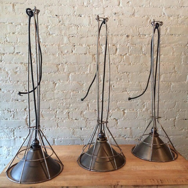 Custom, industrial pendant lights compiled by city Foundry in Brooklyn, NY for our CF Signature line are gunmetal and...