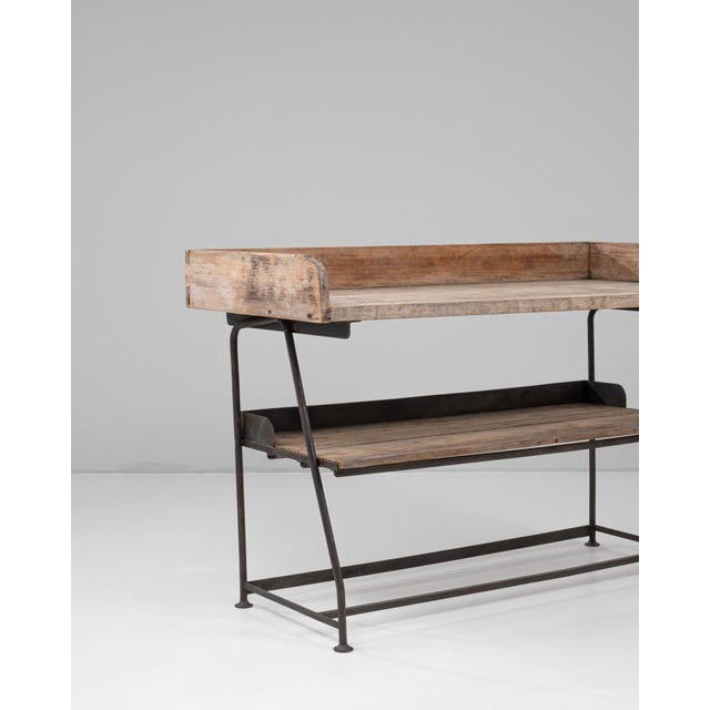 20th Century French Iron Bakery Table with Wooden Top. This French bakery table combines utilitarian charm with...