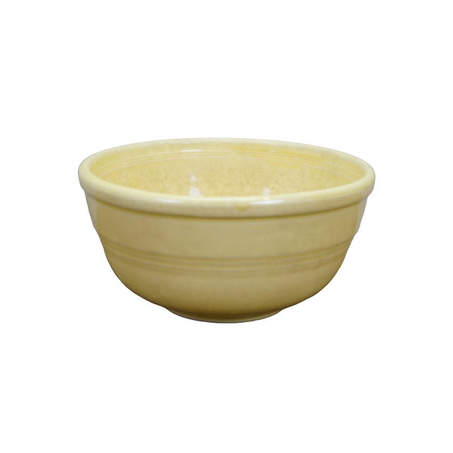 Two classic antique American yellowware kitchen bowls, showcasing the distinct variations in form used for different...