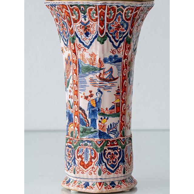 An early 20th-century French faience vase, hand-painted and mounted as a table lamp, worked in the rare cashmere palette —...