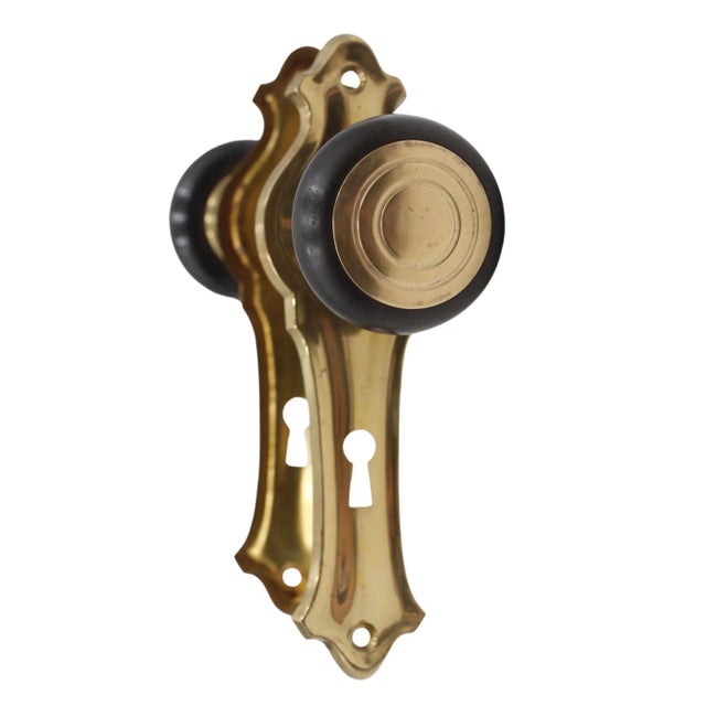 Vintage Art Deco style door knob set with bakelite and brass round door knobs and polished brass back plates. Priced as...