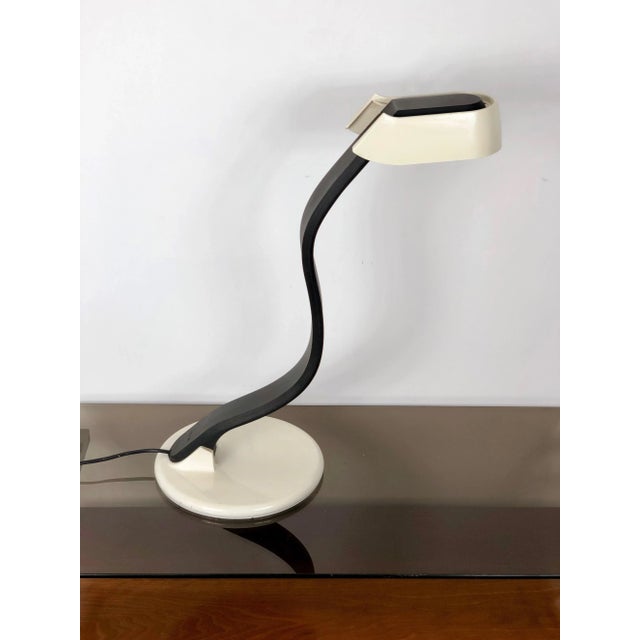 Table lamp in rubber and metal, black and white, made by Bruno Gecchelin for iGuzzini - Italy, 1970s. The model name is...
