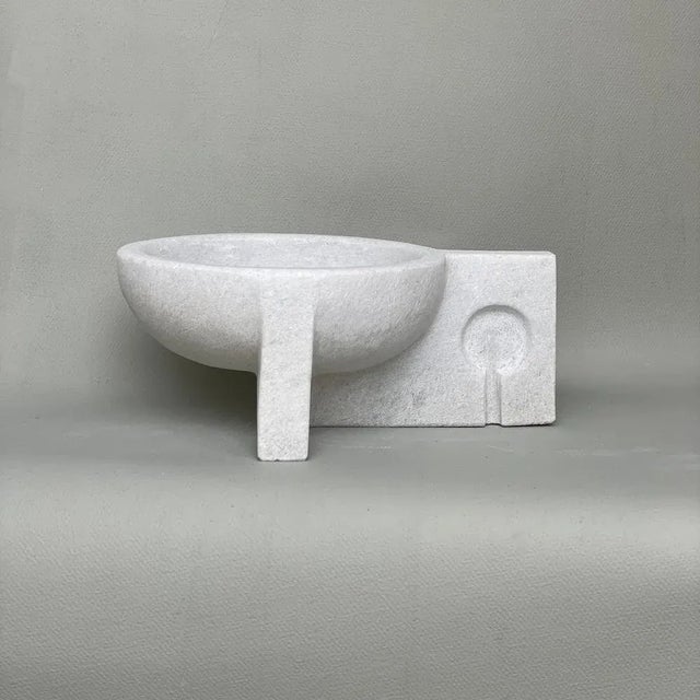 Hand carved marble vessel by tom von kaenel. Dimensions: d 19 x w 25 x h 10 cm. Materials: marble this piece is attributed...