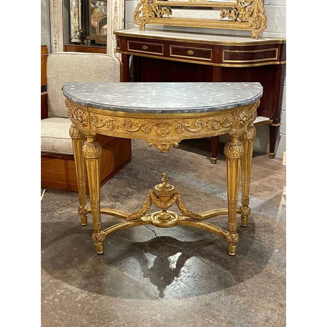 Fine quality 19th century French Louis XVI carved and giltwood demi-lune console. Circa 1860. A timeless and classic touch...