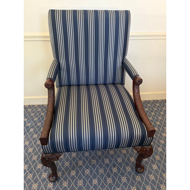 Exceptional pair of handcrafted Kittinger carved mahogany armchairs featuring custom Ralph Lauren pinstripe silk...