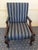 Exceptional pair of handcrafted Kittinger carved mahogany armchairs featuring custom Ralph Lauren pinstripe silk...